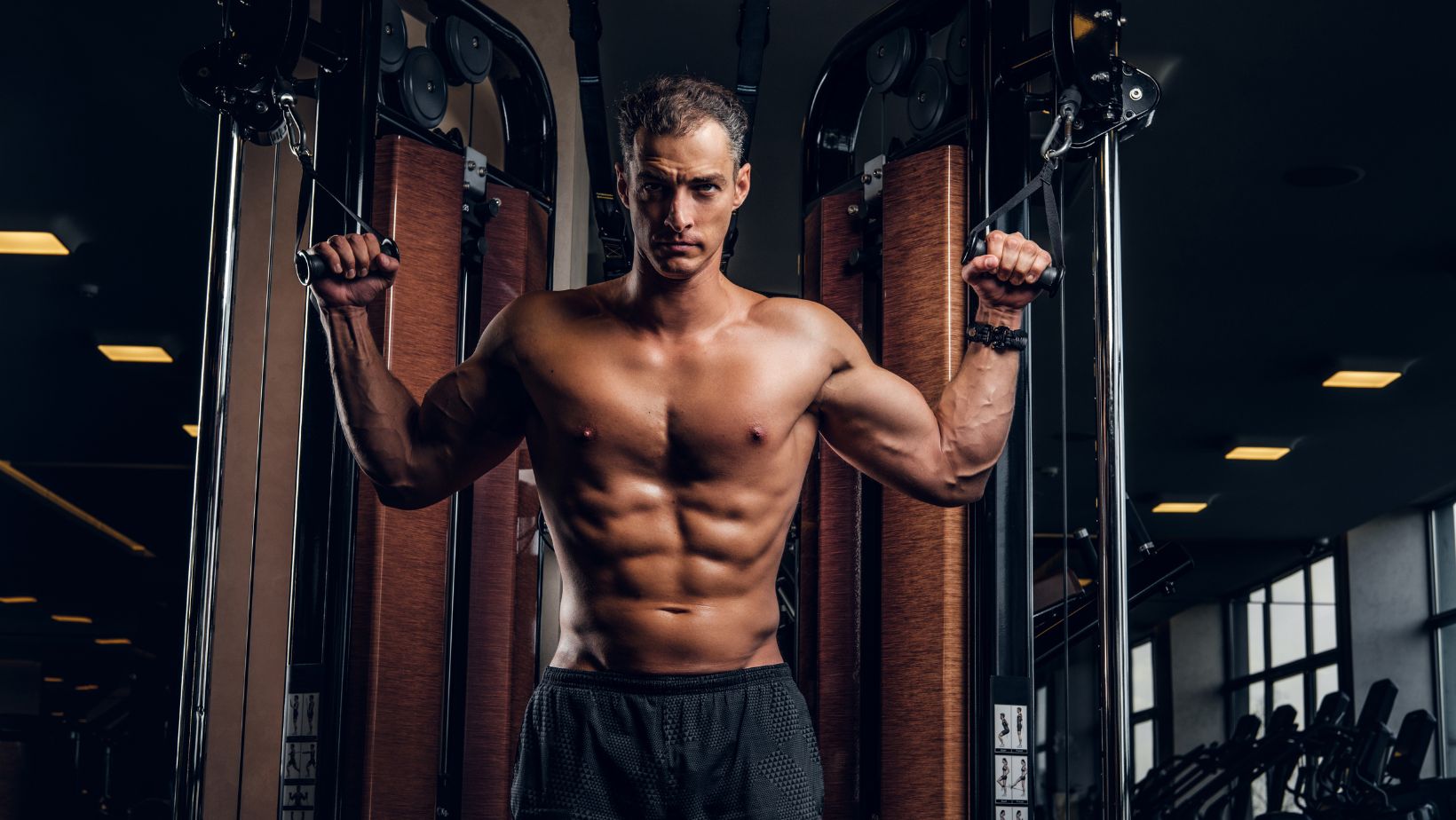 Man using a cable machine to build muscle