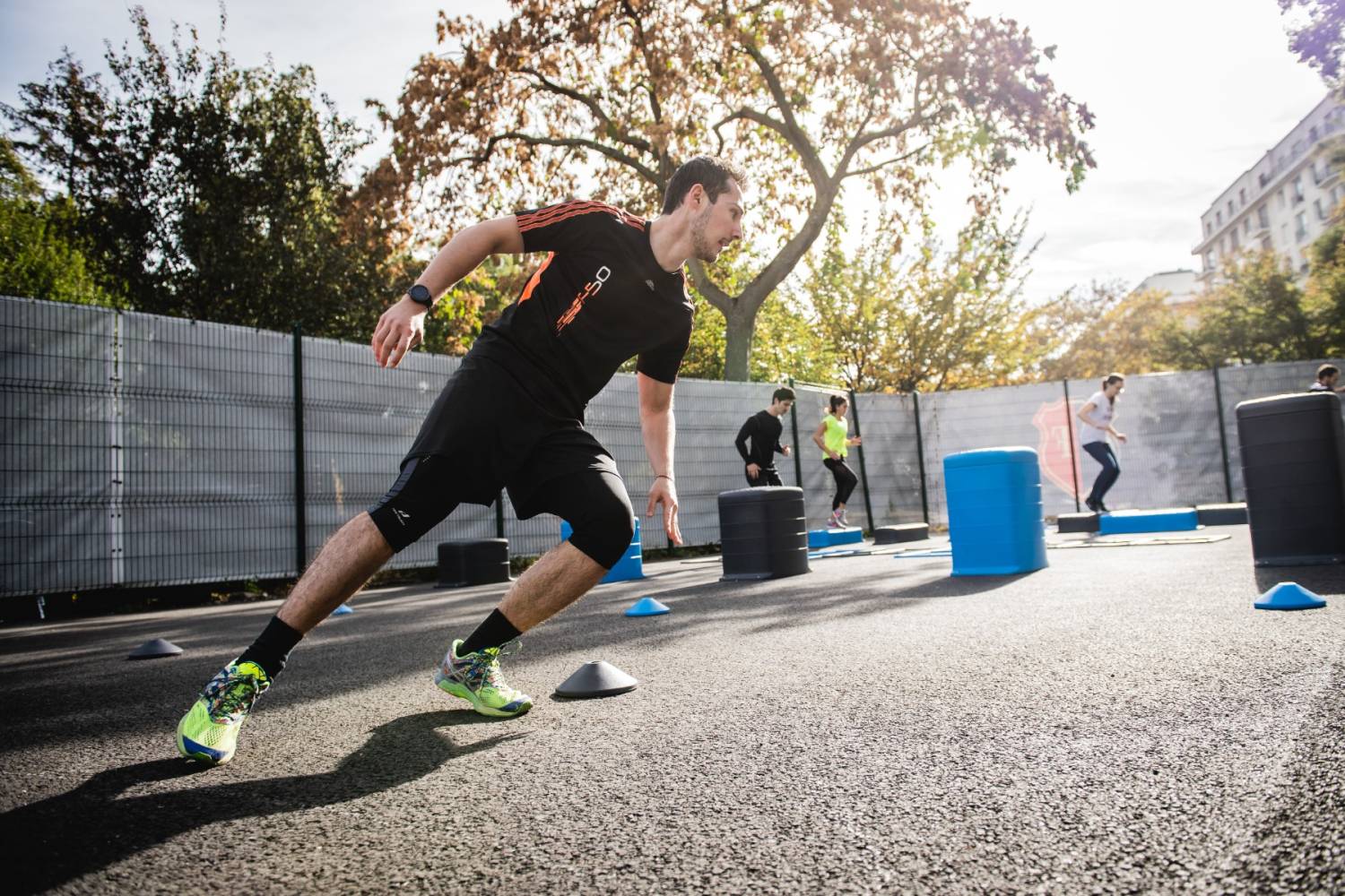 A man doing shuttle runs outdoors